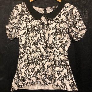 Black and white skull blouse with black collar.